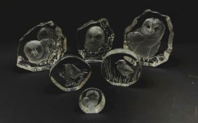 A group of six Mats Jonasson Swedish intaglio moulded glass paperweights, largest H15.5cm.