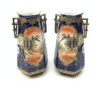 A pair of Japanese Nippon Kinjo vases, of tapering hexagonal form with twin stylised handles, the co