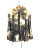 A lined Ocelot fur jacket with leather trim and belt.