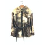 A lined Ocelot fur jacket with leather trim and belt.