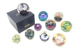 Ten glass paperweights, to include a number of Caithness examples, marked Petunias, Vortice, Tidal W