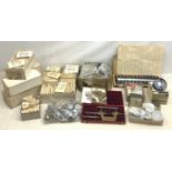 A collection of various watch parts and accessories, to include a large quantity of watch B.C.L. gla