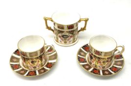 A pair of Royal Crown Derby Imari 1128 coffee cans and saucers, together with a Royal Crown Derby Im