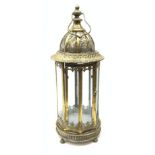 A bronzed effect metal lantern, of hexagonal form with glass panels, pierced domed top and carry han
