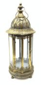 A bronzed effect metal lantern, of hexagonal form with glass panels, pierced domed top and carry han