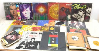 A collection of Vinyl records and singles, to include Stevie Wonder Hotter than July, Blondie Parall