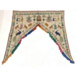 Early 20th century Indian Toran, embroidered in bright colours with figures and animals and Ganesh s