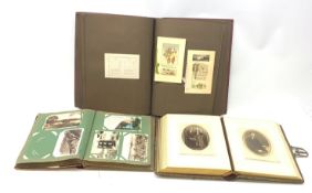 Three albums, the first entitled The Artistic Series of Private Christmas Cards, containing a select