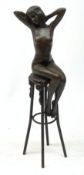 After D H Chiparus, an Art Deco style bronze modelled as a nude female figure seated upon a chair, H