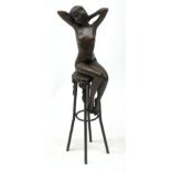 After D H Chiparus, an Art Deco style bronze modelled as a nude female figure seated upon a chair, H