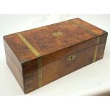 A Victorian walnut and brass banded writing slope, the hinged cover with vacant brass cartouche, ope