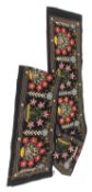 Large velvet crewel work wall hanging worked with bright colours with flowering planters within a st