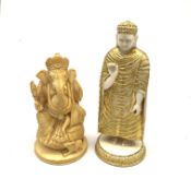 A carved ivory figure, modelled as a robed figure, with gilded detail, H12.5cm, together with a furt