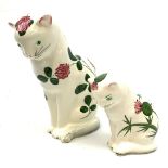 Two Plichta pottery cat figures, the largest example hand painted with clover leaves and flowers, wi