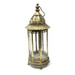 A bronzed effect metal lantern, of hexagonal form with glass panels, pierced domed top and carry han