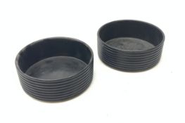 A pair of Regency black papier mache wine coasters, with ribbed sides, D13.5cm.
