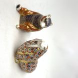 Two Royal Crown Derby paperweights, the first modelled as a Honey Bear, the second as a Walrus, each
