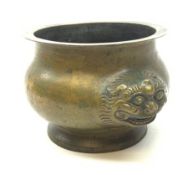 A Chinese bronzed censer, of squat bellied form, with twin qilin mask handles, D24cm.