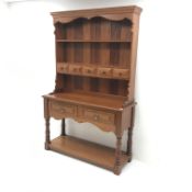 20th century mahogany dresser, raised two tier plate rack with five trinket and two drawers, turned
