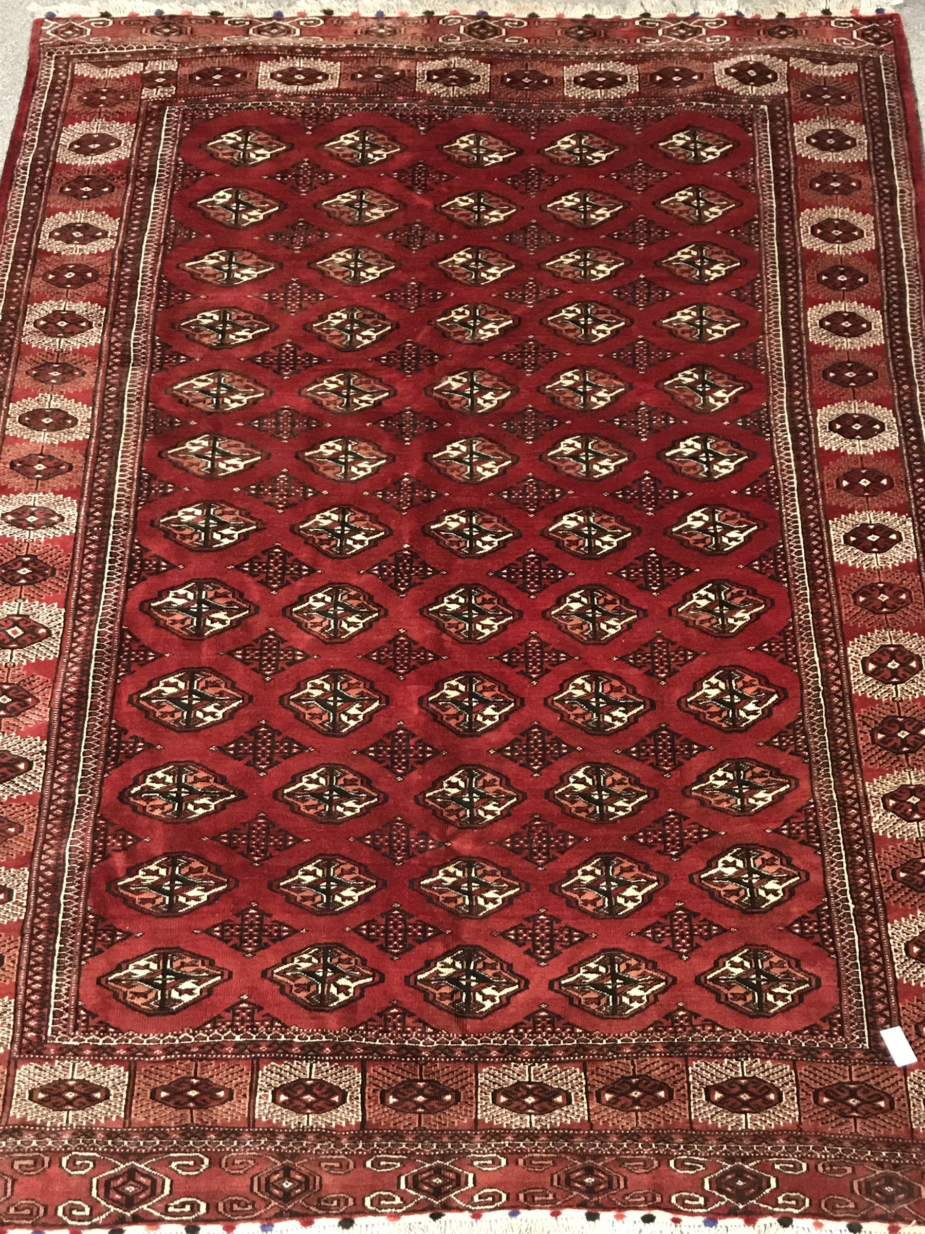 Turkman Tekke Bokhara red ground rug, the field and border decorated with guls, 177cm x 213cm - Image 2 of 8