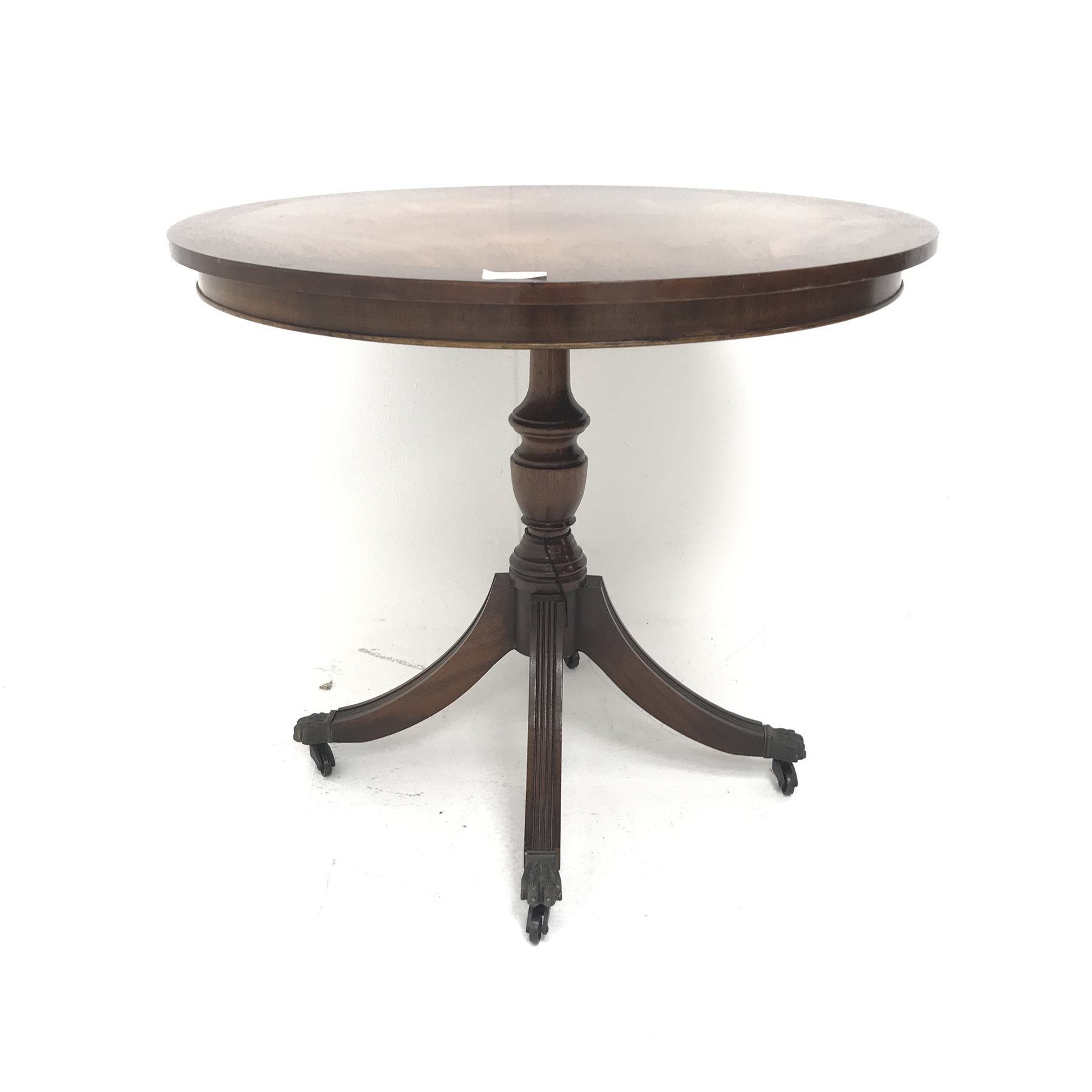 Victorian style mahogany occasional table, single turned and carved column on three scrolling feet (