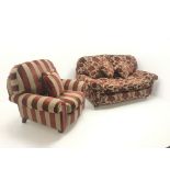 Two seat sofa upholstered in a patterned red and gold fabric, turned supports on castors (W130cm) an
