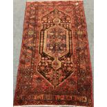 Hamadan red ground rug, central medallion, repeating border, 252cm x 143cm