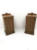 Pair 20th century pitch pine bedside cabinets, raised shaped back, moulded top, single door, plinth