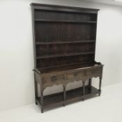 Early 19th century oak potboard dresser, raised three tier plate rack above three drawers, turned su