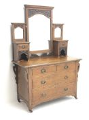 Early 20th century oak dressing chest, fitted with two short and two long drawers with Art Nouveau c