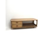 Ercol light elm 'Minerva' long rectangular coffee table fitted with two drawers on castors, 125cm x