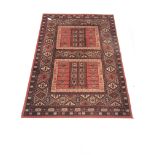 Persian design red ground rug, repeating border, 190cm x 137cm