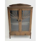 Early 20th century walnut display cabinet, sun burst astragal glazed doors with mottled glass, two a