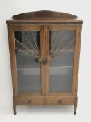 Early 20th century walnut display cabinet, sun burst astragal glazed doors with mottled glass, two a
