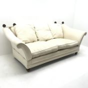 Knole style two seat sofa, upholstered in a beige fabric, turned supports, W200cm