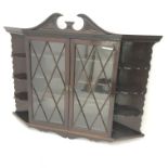 Early 20th century wall hanging display cabinet, swan neck pediment, two door enclosing three shelv