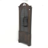 20th century walnut corner cabinet, arched swan neck pediment with central finial, single glazed do