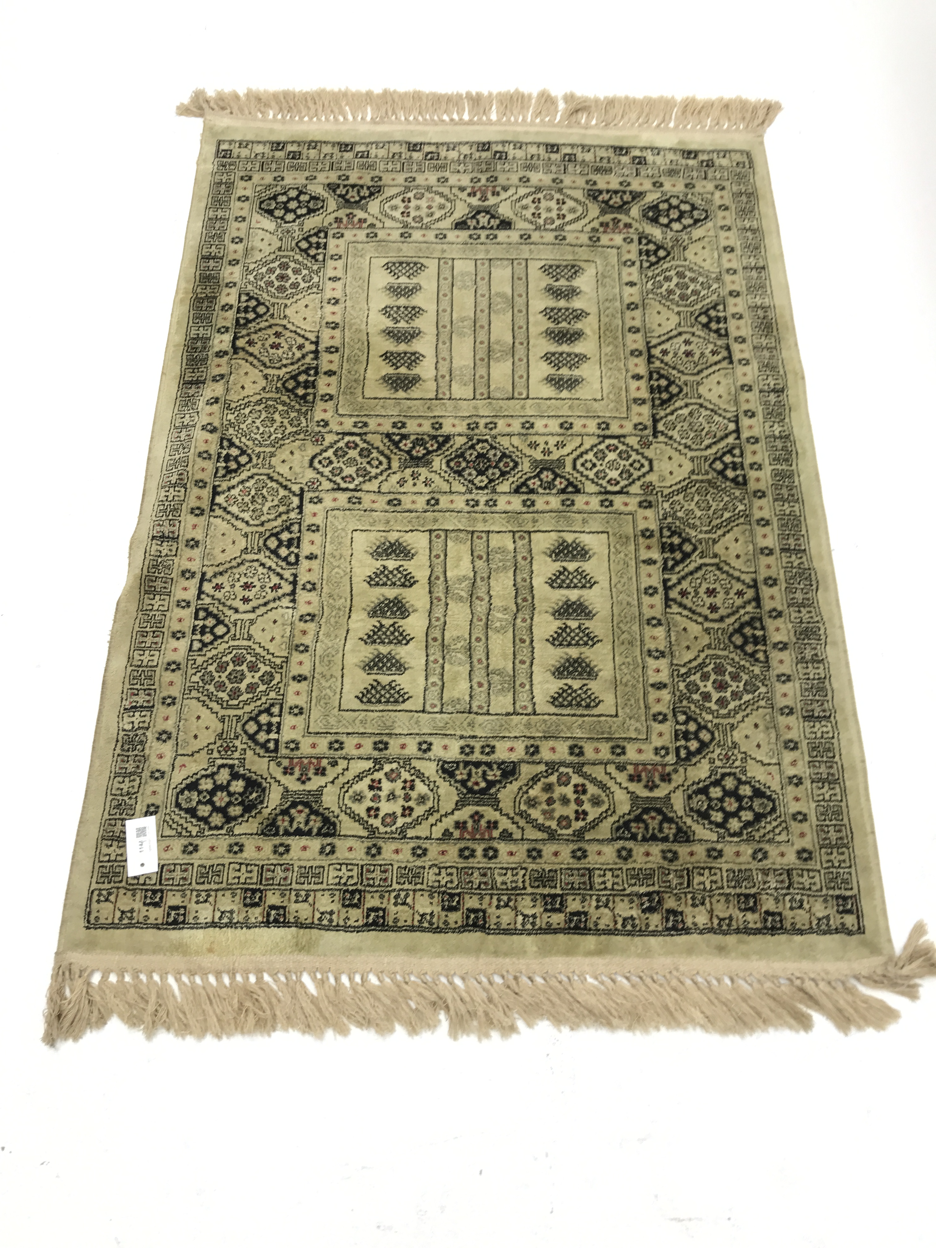 Persian design lime ground rug, repeating border, 140cm x 98cm