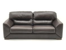 Three seat sofa upholstered in brown leather (W210cm) a pair matching armchairs (W110cm) and footst