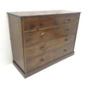 Early 20th century stained pine chest, two short and three long drawers, plinth base, W127cm, H93cm,