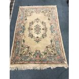 Chinese style beige ground rug, central medallion, repeating border, 276cm x 183cm