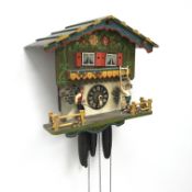 Two Black Forest style wall hanging cuckoo clocks