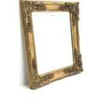 Bevelled edge mirror in ornate swept gilt frame, 69cm x 79cm