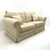 Duresta two seat sofa upholstered in Ivory coloured fabric with floral pattern, scrolled arms, W205c