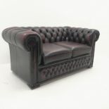 Two seat chesterfield sofa upholstered in deep buttoned ox blood leather, W155cm