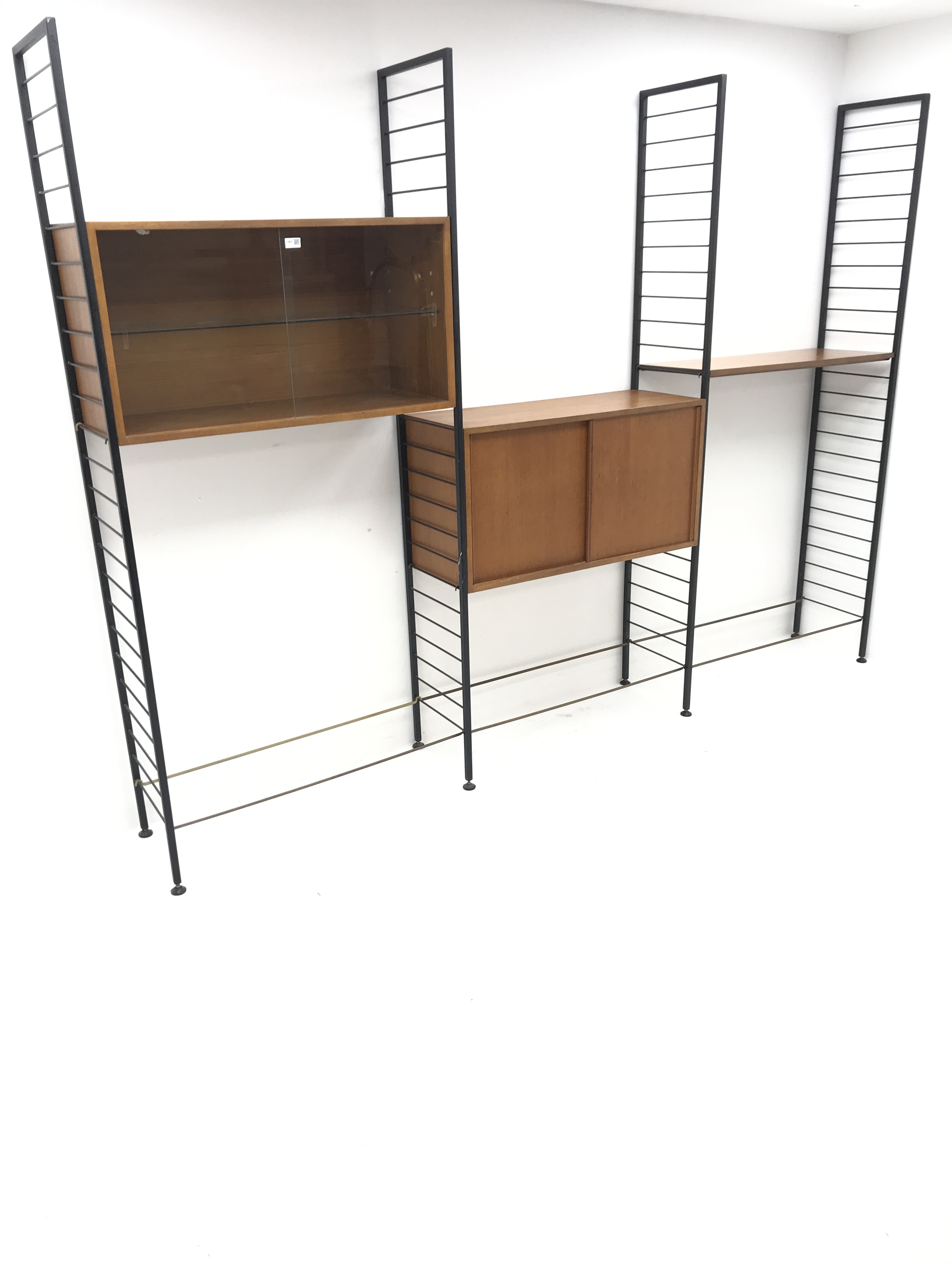 Staples Ladderax three bay sectional wall unit, two teak units comprising of solid and glazed slidin