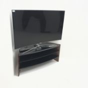 Samsung UE49KS9000T (49") curved television on walnut and glass corner stand