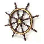 Ship's brass bound mahogany wheel with eight turned spindles and central boss D94cm