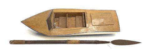 Battery powered model speedboat with blue and white painted wooden hull, simulated planked deck, two