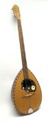 Eight-string bouzouki with segmented rosewood back and spruce top, L97cm